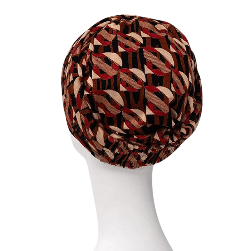 Rückseite des Sapphire Boho Turbans im Tribal Art Muster auf einer weißen Schaufensterpuppe